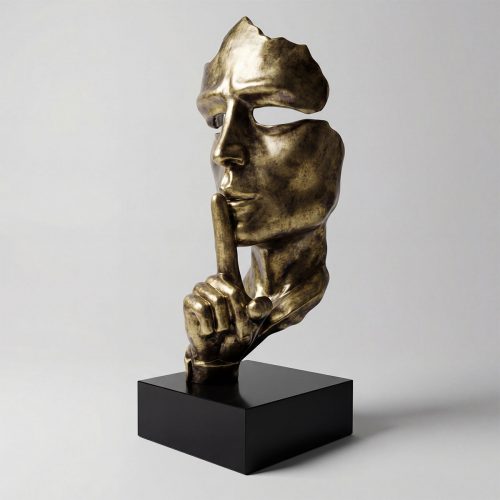 sculpture figure visage stylisé en fibre de verre dorée style contemporain main au doigt sur les lèvres, déco intérieure ou événementiel